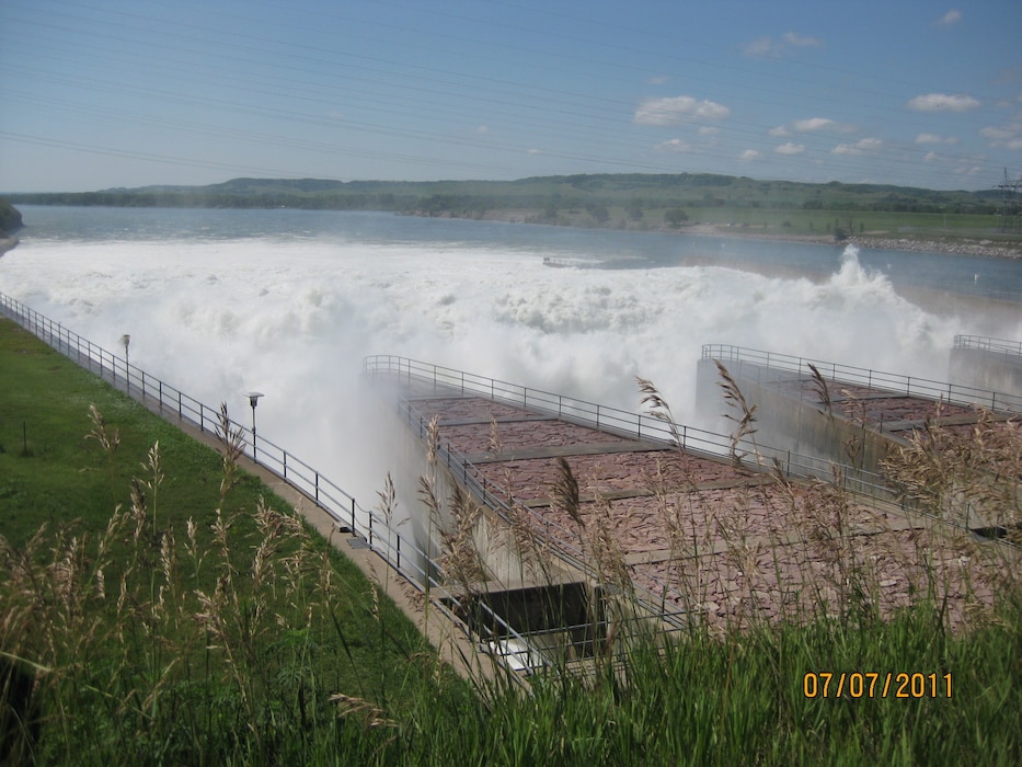 Water churns downstream after release from Fort Randall Dam’s spillway gates