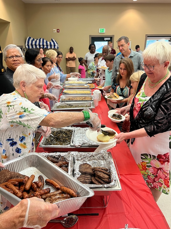 Volunteers pass out food at a Chapel event.