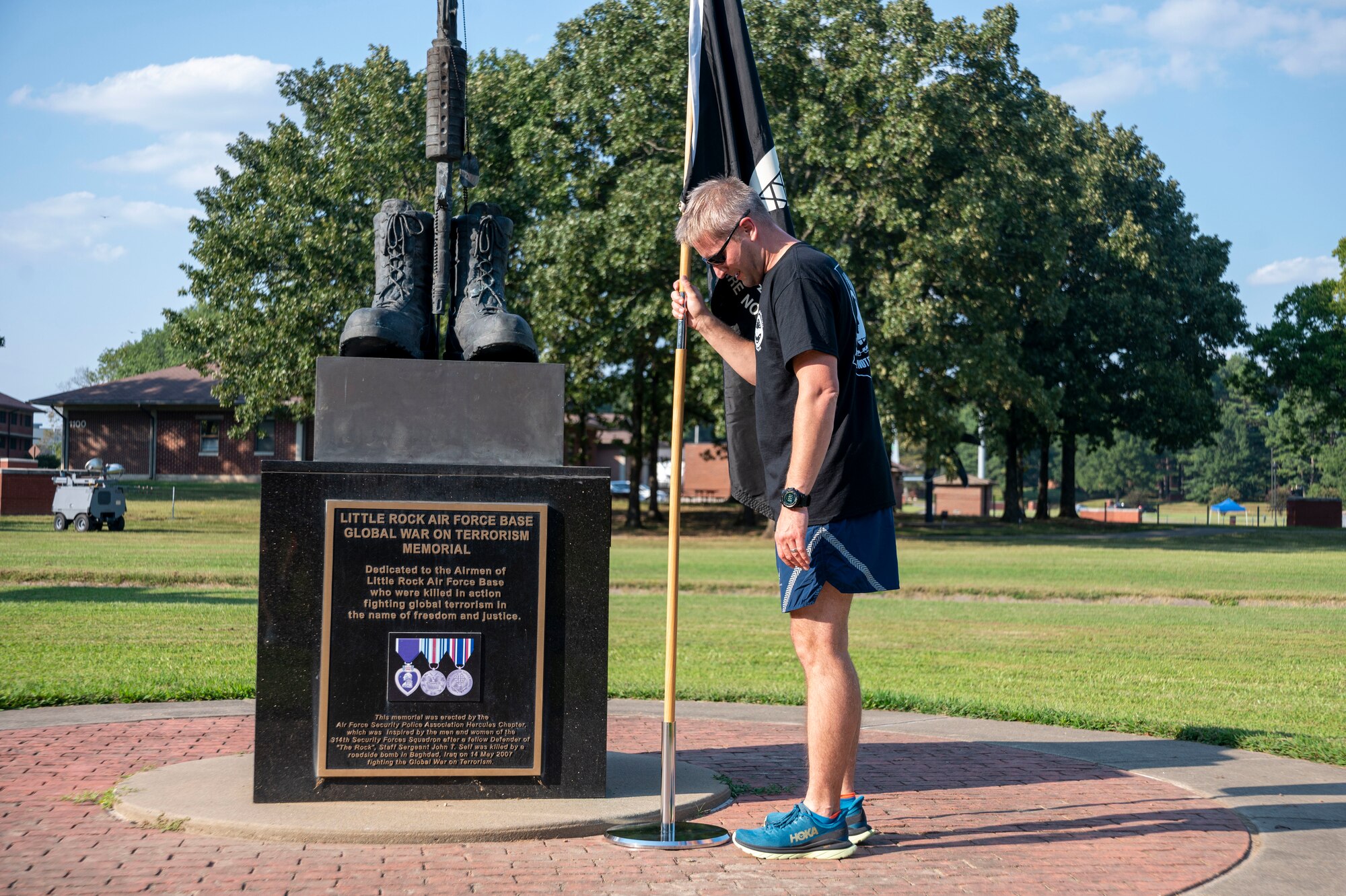 A man stakes a flag
