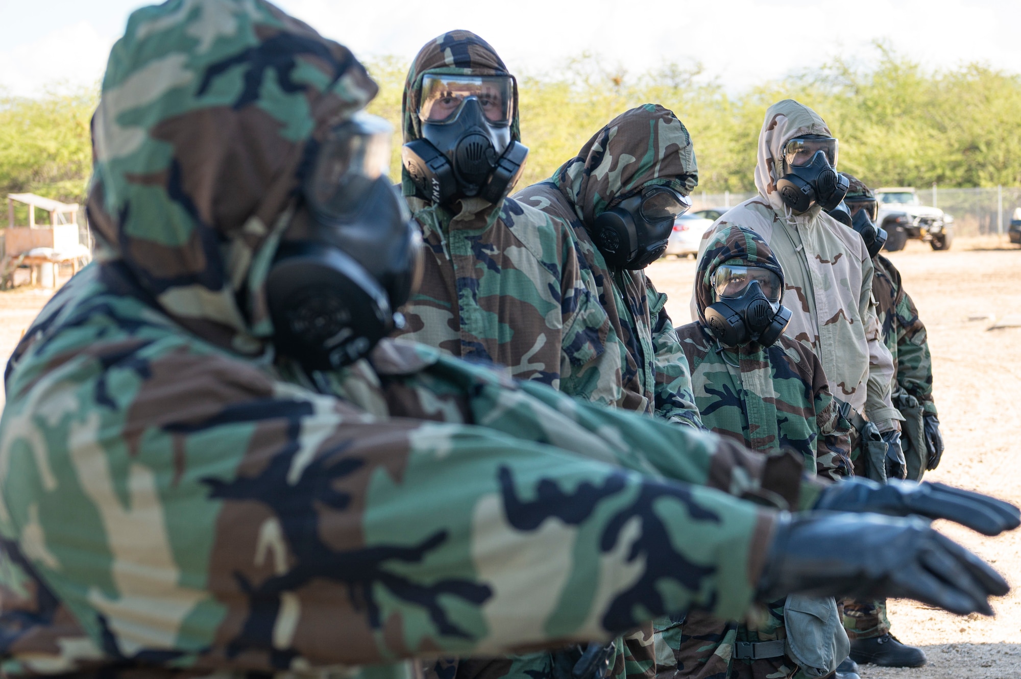 Airmen prepare to move through a Mission Oriented Protective Posture zone, during a chemical, biological, radiological and nuclear defense exercise Sept. 14, 2022, at Joint Base Pearl Harbor-Hickam, Hawaii. Post-attack reconnaissance teams conduct these to check for casualties, unexploded ordinances, and contamination from CBRN weapons. (U.S. Air Force photo by Staff Sgt. Jacob M. Thompson)