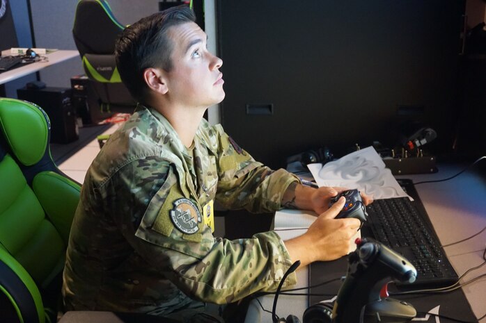 photo of US Military member working at a simulator