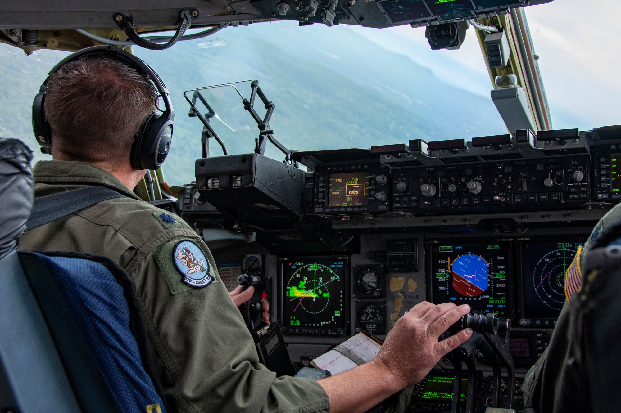 U.S. Air Force Lt. Col. Seth Rann, 326th Airlift Squadron aircraft commander, flies a C-17 Globemaster III aircraft, to Westover Air Reserve Base, Massachusetts, Sept. 11, 2022. The 326th AS provided the airlift for the 439th Aeromedical Evacuation Squadron so they could conduct readiness training, including medical operations before, during and after the flight.  (U.S. Air Force photo by Senior Airman Kalee Sexton)
