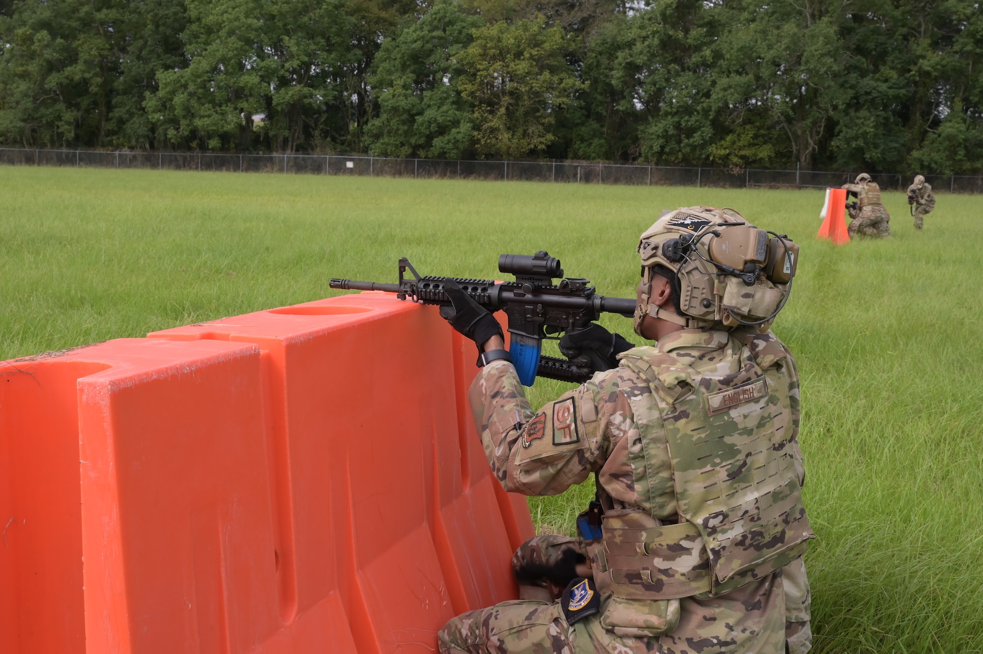 a man provides cover fire during a training event