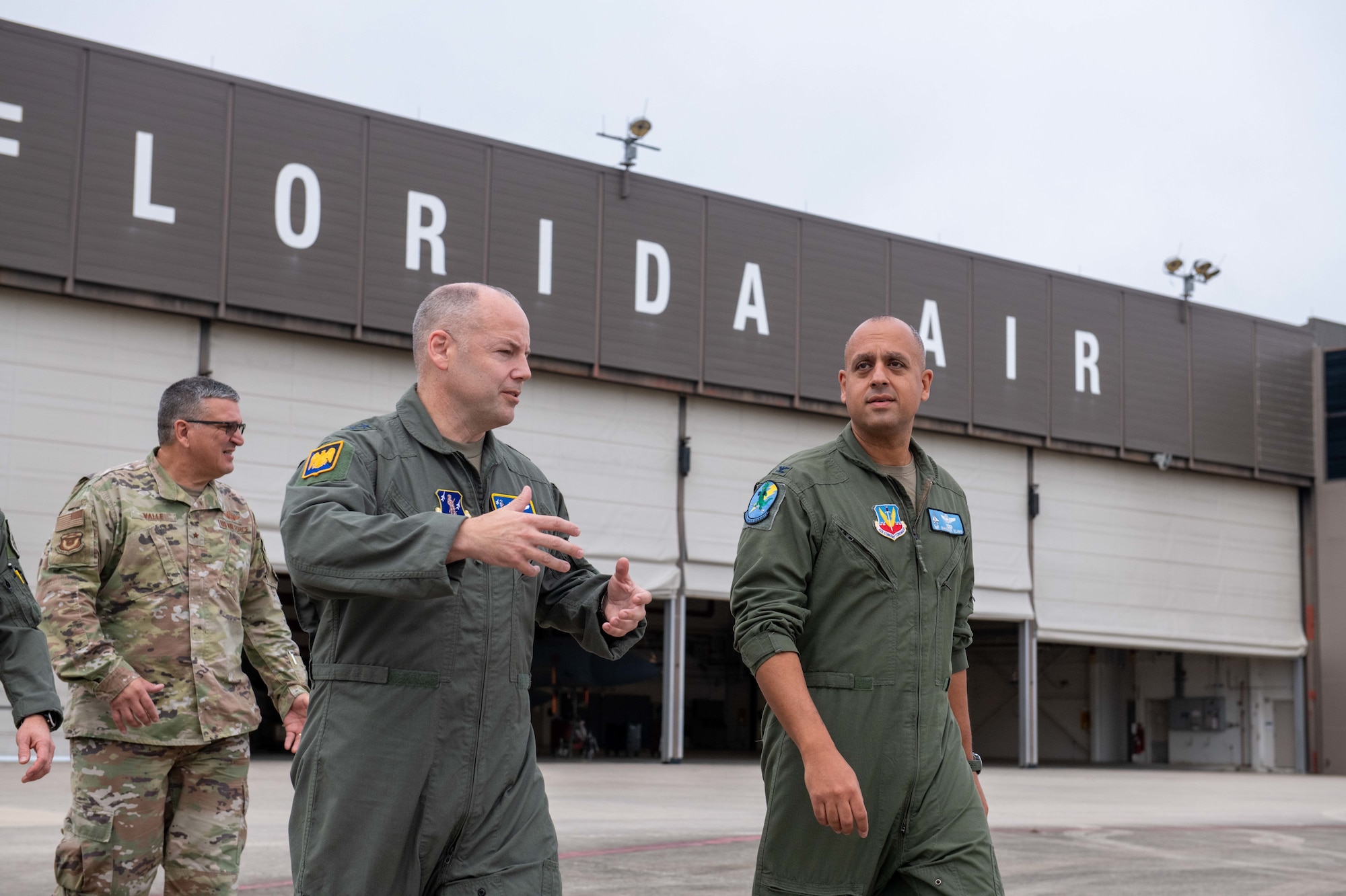 U.S. Air Force Maj. Gen. Duke Pirak, center, deputy director, Air National Guard, speaks with Col. Mansour Elhihi, right, commander, 125th Operations Group, 125th Fighter Wing, Florida National Guard during a visit to the Jacksonville Air National Guard Base, Florida, Sept. 13, 2022. During his visit, Pirak received a mission brief, an update on the Wing's F-35A Lightning II conversion and recognized five outstanding Airmen from across the unit. (U.S. Air National Guard photo by Tech. Sgt. Chelsea Smith)