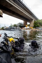 U.S. Navy SEALs assigned to a Naval Special Operations Team, tread water while preparing to go underwater during a dive mission as part of exercise UNITAS LXIII in Rio de Janeiro, Sept. 12, 2022.