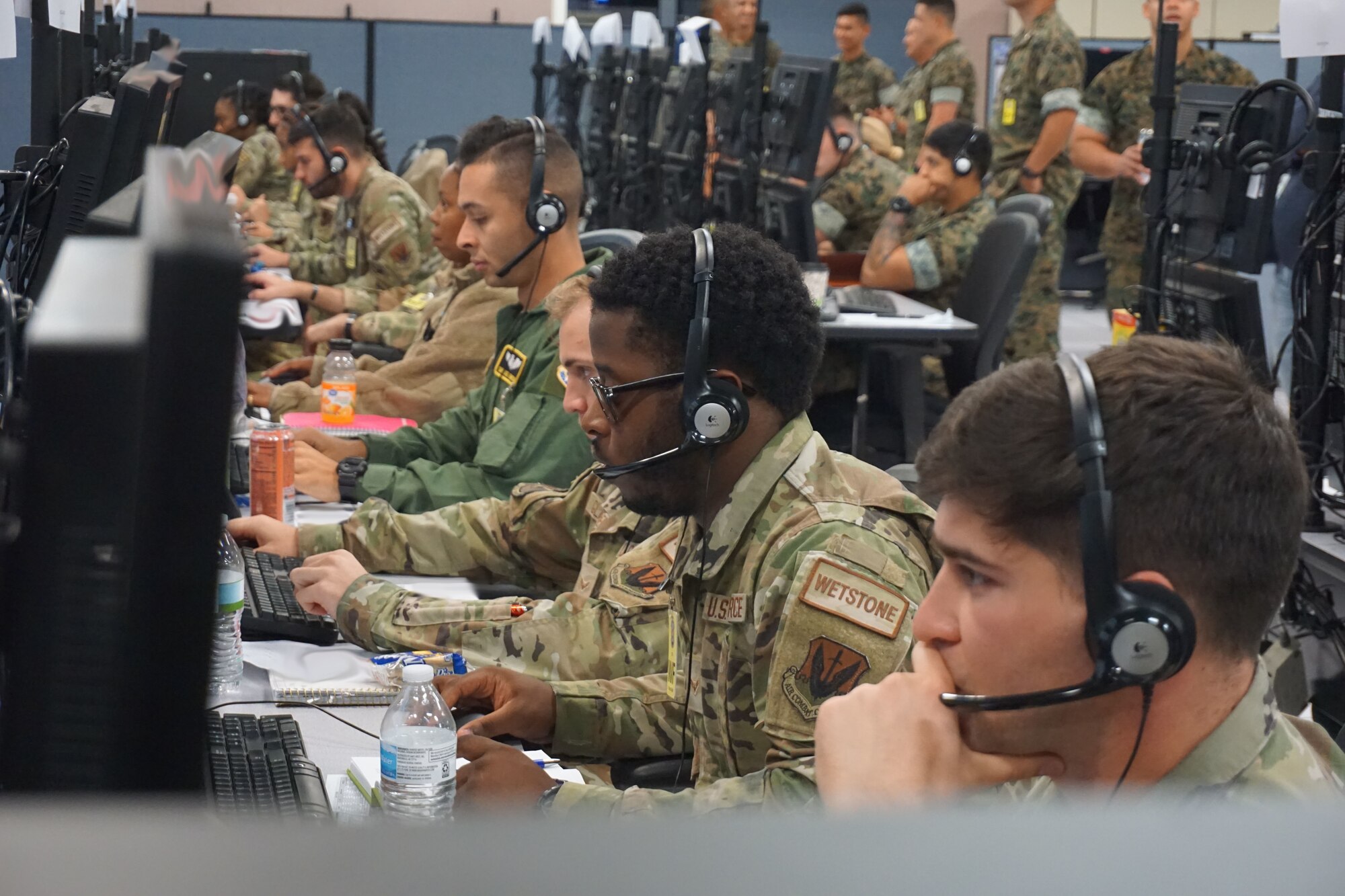 photo of US Military members working at computers