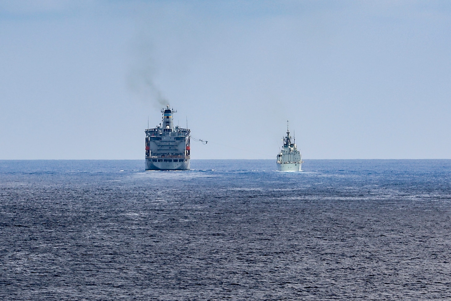 SOUTH CHINA SEA (Sept. 19, 2022) The Royal Canadian Navy Halifax-class frigate HMCS Vancouver (FFH 331), right, conducts a replenishment-at-sea with U.S. Military Sealift Command Henry J. Kaiser-class replenishment oiler USNS Big Horn (T-AO 198) while conducting integrated operations with U.S. Navy Arleigh Burke-class guided-missile destroyer USS Higgins (DDG 76) in the South China Sea, Sept. 19. Higgins is assigned to Commander, Task Force 71/Destroyer Squadron (DESRON) 15, the Navy’s largest forward-deployed DESRON and the U.S. 7th Fleet’s principal surface force. (U.S. Navy photo by Mass Communication Specialist 1st Class Donavan K. Patubo)