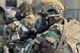 A member of the 111th Security Forces Squadron holds his weapon at the ready position while wearing Mission Oriented Protective Posture (MOPP) gear and body armor during a readiness exercise held by the 111th Attack Wing at Biddle Air National Guard Base in Horsham, Pennsylvania, Sept. 17, 2022. The exercise, which took place from Sept. 15-18, involved a scenario in which 111th SFS responded to a simulated threat while wearing full MOPP gear.