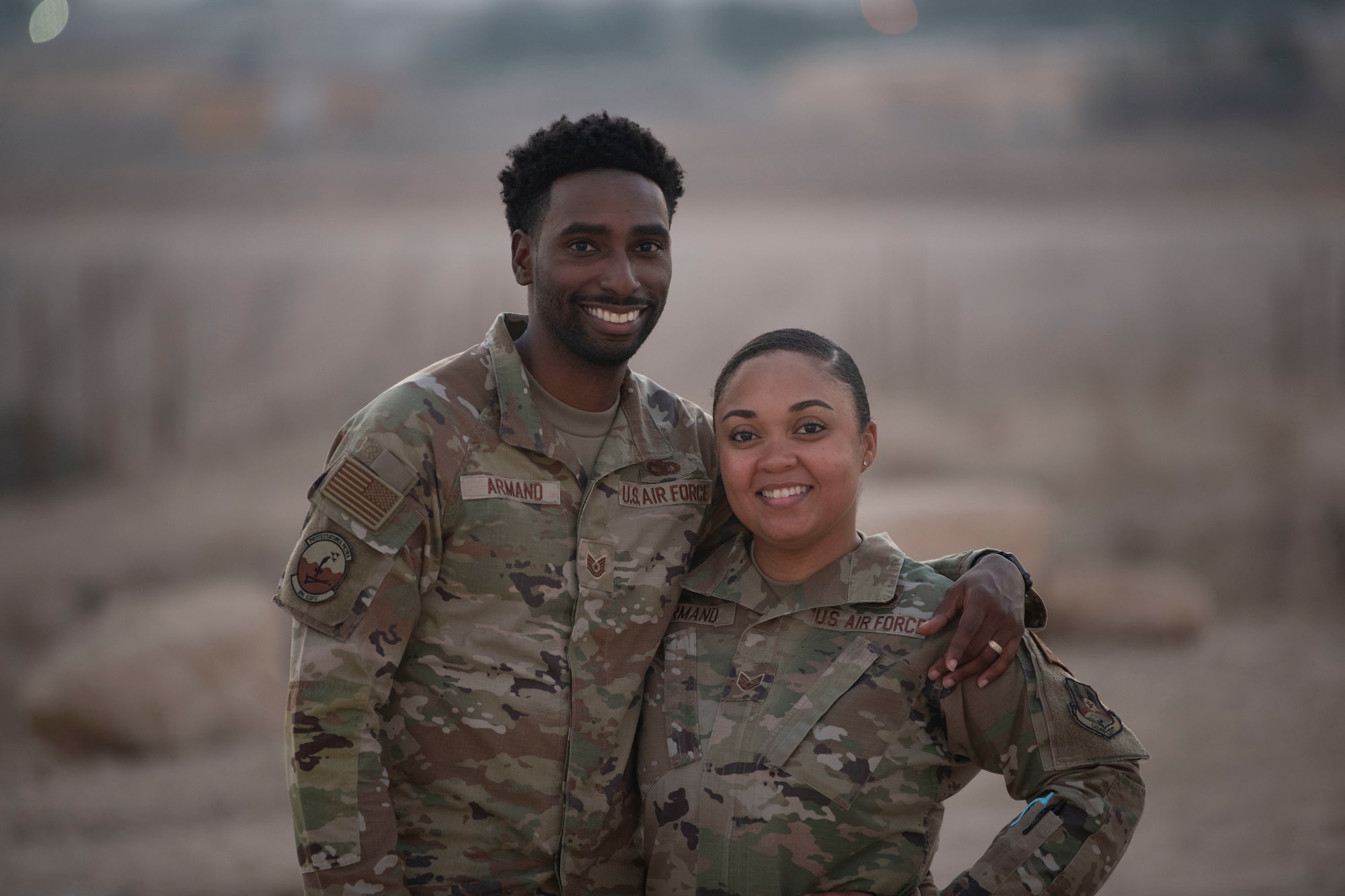 U.S. Air Force Technical Sgt. Vashard Armand, 386th Expeditionary Security Forces Squadron NCOIC of installation area access, and U.S. Air Force Staff Sgt. Ashley Armand, 386th Expeditionary Force Support Squadron readiness manager, are stationed together at Ali Al Salem Air Base, Kuwait, September 5, 2022. The Armands' first met on a deployment to Al Dhafra Air Base in 2016. (U.S. Air Force photo by Staff Sgt. Ashley Mikaio)