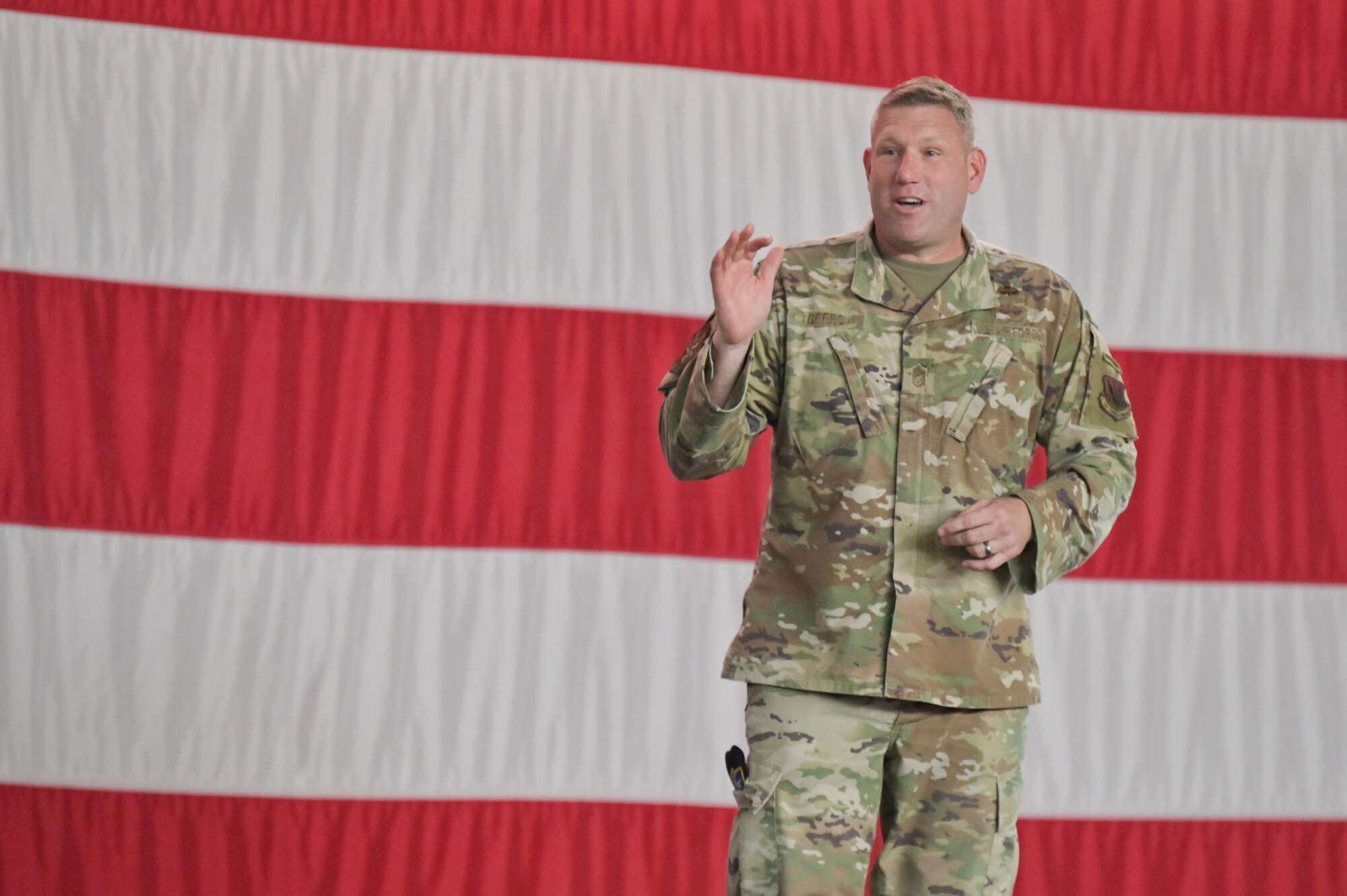 U.S. Air Force Chief Master Sgt. Justin Geers, 23rd Wing command chief, gives a speech during a staff sergeant release party, Sept. 16, 2022, at Moody Air Force Base, Georgia. Staff sergeant is the first rank in the non-commissioned officer tier, bridging the gap between Airmen and senior NCOs. (U.S. Air Force photo by Senior Airman Rebeckah Medeiros)