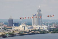 U.S. Coast Guard Aviation Training Center, Mobile Alabama.  Four Coast Guard MH-60T Helicopters fly in formation over Mobile Bay.  Official U.S. Coast Guard Photograph by Phillip Floyd