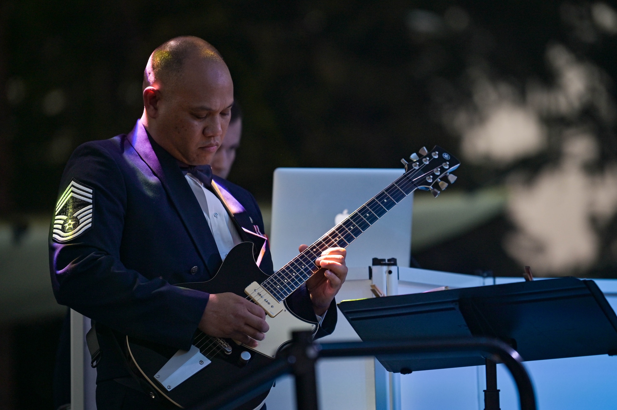 U.S. Air Force Chief Master Sgt. Mauro Ordinario, 23rd Maintenance Group superintendent, plays the National Anthem during the 75th Air Force Ball, Sept. 17, 2022, at Moody Air Force Base, Georgia. The Air Force Ball celebrates 75 years of tradition and Airmen answering their nation's call to serve their country. (U.S. Air Force photo by Senior Airman Rebeckah Medeiros)