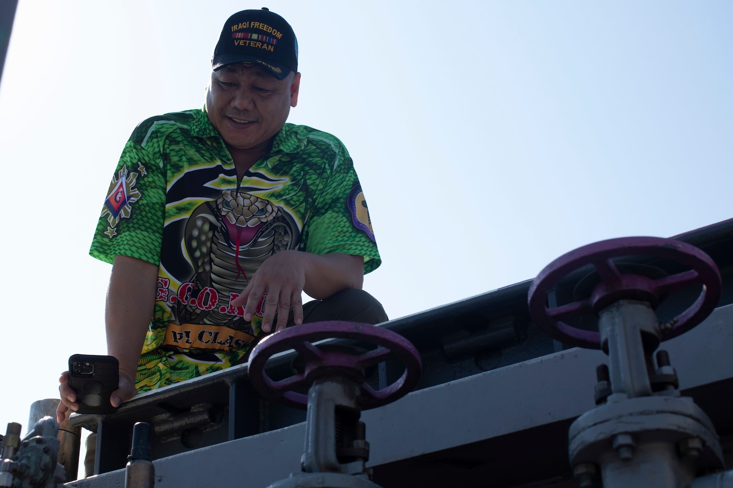 NORFOLK, Va. (Sept. 20, 2022) A plank owner reminisces at his old fueling station on the Wasp-class amphibious assault ship USS Bataan (LHD 5) after Bataan’s 25th birthday ceremony, Sept. 20, 2022. Bataan is homeported at Naval Station Norfolk. (U.S. Navy photo by Mass Communications Specialist 2nd Class Darren Newell)