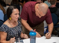 Two members from the 919th Special Operations Wing participate in an art activity.