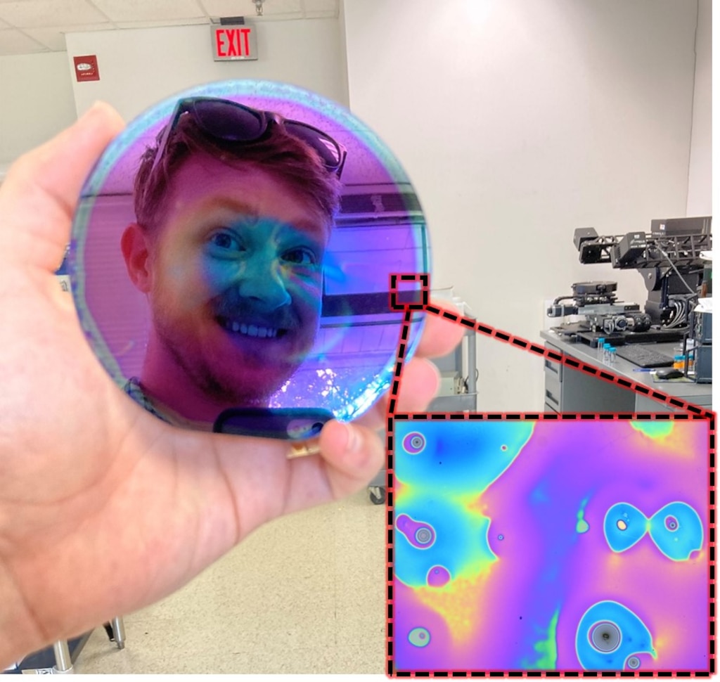 Dr. Jared Cobb holds up ultra-thin polymer