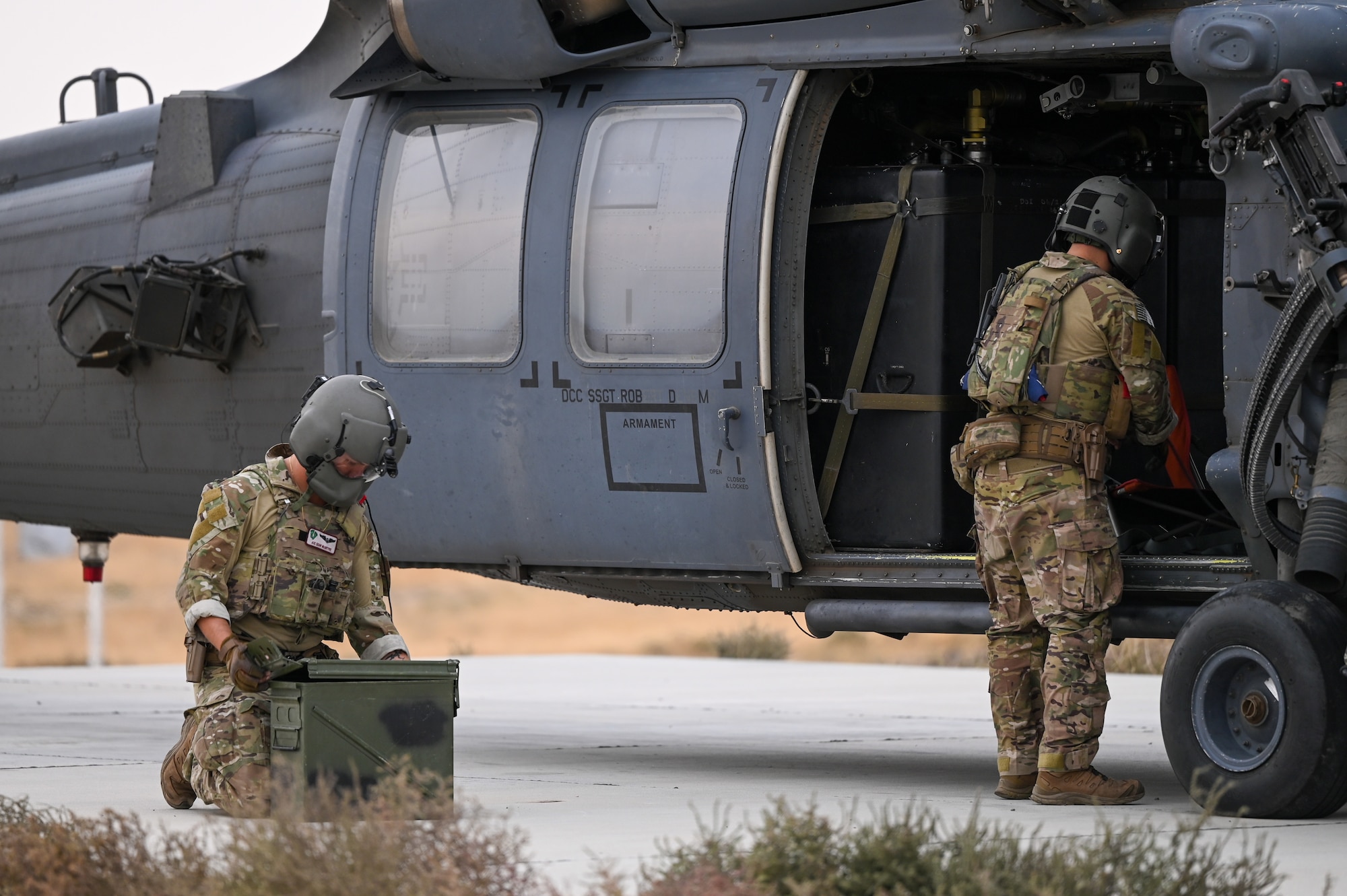 A photo of Airmen loading ammo.