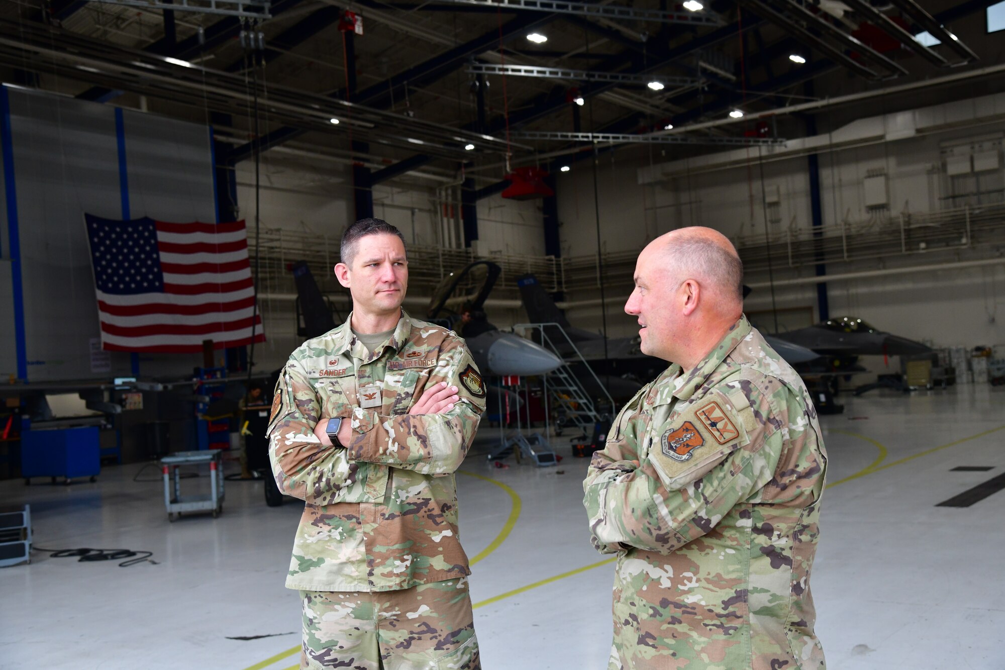 Production Assessment Team Consultant and 152nd Maintenance Group Commander, Col. Jason Sander cross talks with 148th Aircraft Maintenance Squadron Commander, Lt. Col. Ryan Blazevic during an Air National Guard Production Assessment Team site visit at the 148th Fighter Wing September 12-15, 2022.
