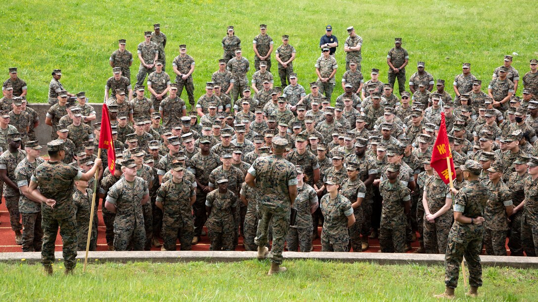 U.S. Marine Corps Lt. Col. David S. Rainey, commanding officer, Security Battalion, briefs Marines with Headquarters Company and Service Company at Butler Stadium, Marine Corps Base Quantico, Virginia, May 25, 2022. This is the first battalion-wide formation held by Security Battalion since the Covid-19 pandemic began and was held to brief future events regarding the battalion. (U.S. Marine Corps photo by Lance Cpl. Caden Phillips)