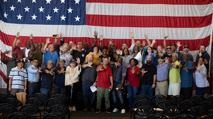 NORFOLK, Va. (Sept. 20, 2022) Plank owners pose for a photo after the Wasp-class amphibious assault ship USS Bataan (LHD 5) 25th birthday celebration Sept. 20, 2022. Bataan is homeported at Naval Station Norfolk. (U.S. Navy photo by Mass Communications Specialist 2nd Class Darren Newell)
