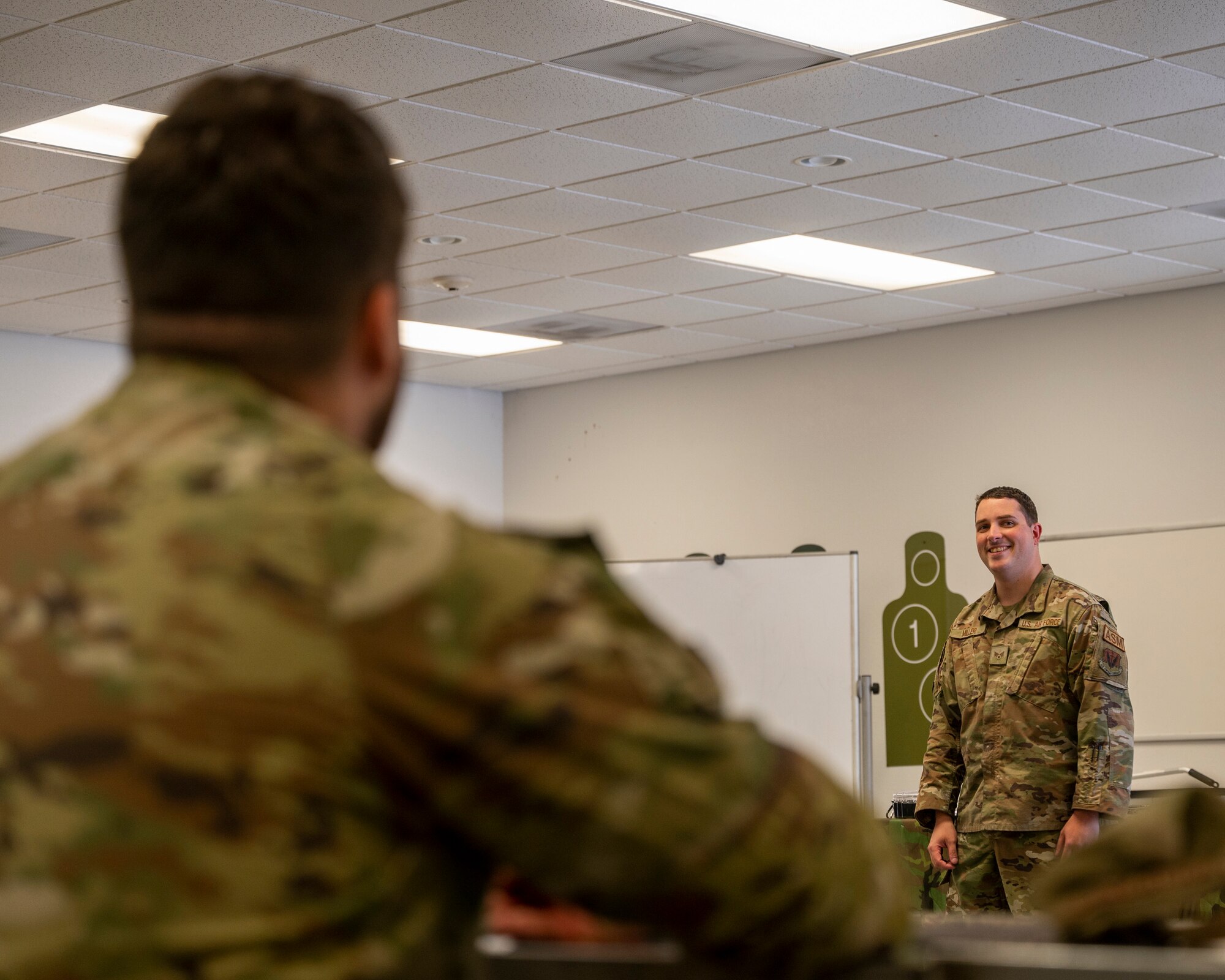 Picture of a man speaking to a class.