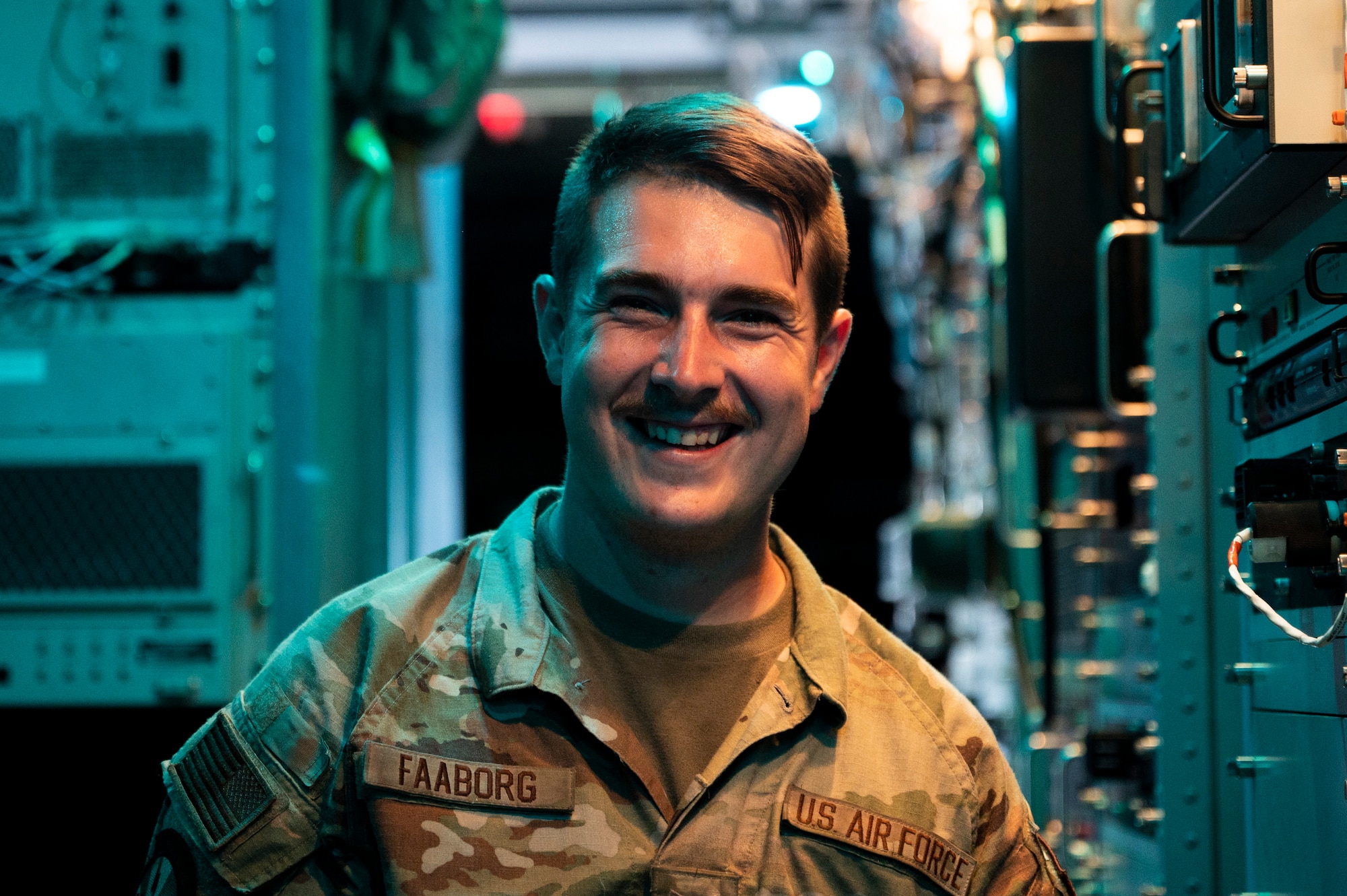 Photo of SSgt. Faaborg inside EC-130H aircraft.