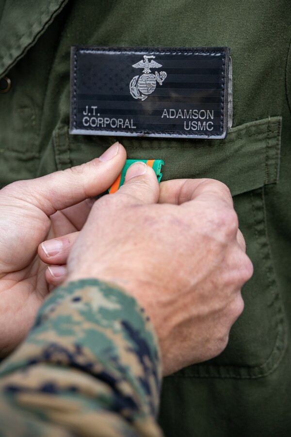 A U.S. Marine with Marine Light Attack Helicopter Squadron (HMLA) 773, 4th Marine Aircraft Wing, Marine Forces Reserve in support of Special Purpose Marine Air-Ground Task Force UNITAS LXIII, receive a Navy and Marine Corps Achievement Medal, at Ilha do Governador, Rio de Janeiro, during exercise UNITAS LXIII, Sept. 18, 2022. These awards were given to show superior performance in their duties during the execution of exercise UNITAS. UNITAS trains forces to conduct joint maritime operations through the execution of anti-surface, anti-submarine, anti-air, amphibious and electronic warfare operations that enhance warfighting proficiency and increased interoperability among participating navy and marine forces. (U.S. Marine Corps photo by Cpl. Jonathan L. Gonzalez)