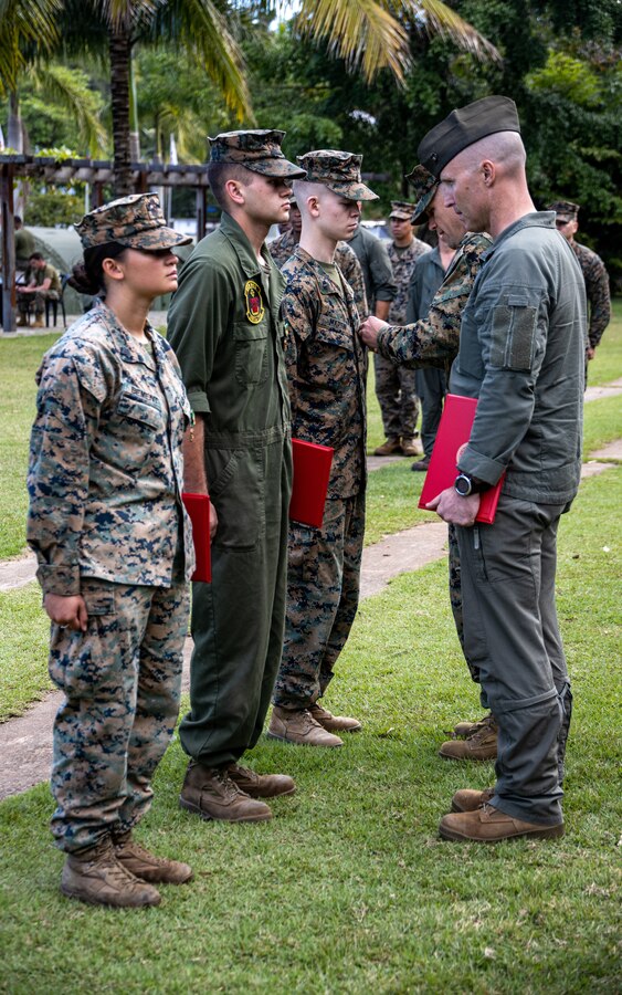 U.S. Marines with Marine Light Attack Helicopter Squadron (HMLA) 773, 4th Marine Aircraft Wing, Marine Forces Reserve in support of Special Purpose Marine Air-Ground Task Force UNITAS LXIII, receive a Navy and Marine Corps Achievement Medal, at Ilha do Governador, Rio de Janeiro, during exercise UNITAS LXIII, Sept. 18, 2022. These awards were given to show superior performance in their duties during the execution of exercise UNITAS. UNITAS, which is Latin for “unity,” was conceived in 1959 and has taken place annually since first conducted in 1960. This year marks the 63rd iteration of the world’s longest-running annual multinational maritime exercise. Additionally, this year Brazil celebrated its bicentennial, a historical milestone commemorating 200 years of the country’s independence. (U.S. Marine Corps photo by Cpl. Jonathan L. Gonzalez)