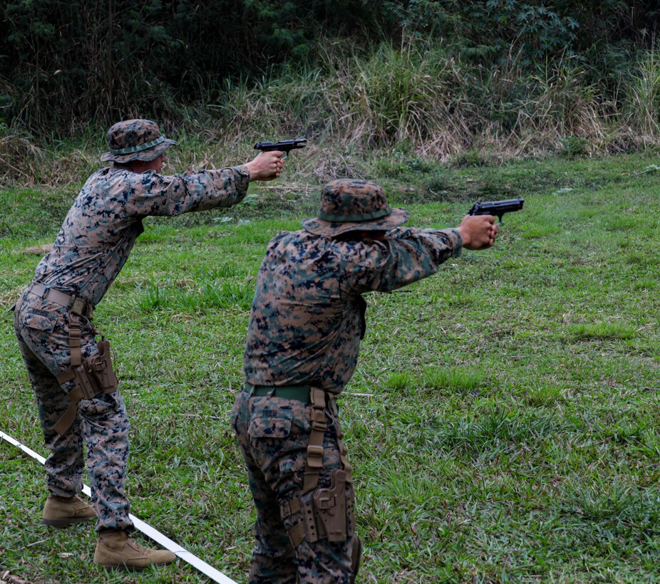 U.S. Marines fire at their targets using an M9 pistol during a pistol qualification range during exercise UNITAS LXIII in Ilha do Governador, Rio de Janeiro, Sept. 14, 2022. UNITAS is the world’s longest-running annual multinational maritime exercise that focuses on enhancing interoperability among multiple nations and joint forces during littoral and amphibious operations in order to build on existing regional partnerships and create new enduring relationships that promote peace, stability, and prosperity in the U.S. Southern Command’s area of responsibility. (U.S. Marine Corps photo by Lance Cpl. Trystan Taft)