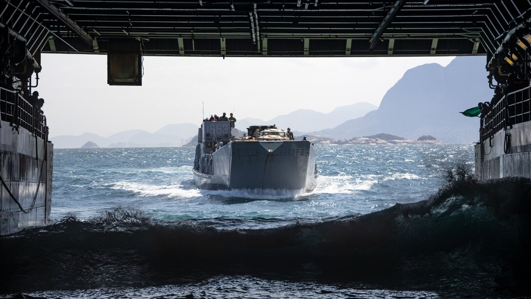 U.S. Navy Landing Craft, Utility 1663 approaches the well deck of the amphibious transport dock ship USS Mesa Verde (LPD 19) during embarkation operations off the coast of Brazil in support of Special Purpose Marine Air-Ground Task Force UNITAS LXIII, as part of exercise UNITAS LXIII Sept. 6, 2022. UNITAS is the world’s longest-running annual multinational maritime exercise that focuses on enhancing interoperability among multiple nations and joint forces during littoral and amphibious operations in order to build on existing regional partnerships and create new enduring relationships that promote peace, stability, and prosperity in the U.S. Southern Command’s area of responsibility. (U.S. Marine Corps photo by Sgt. Brendan Mullin)