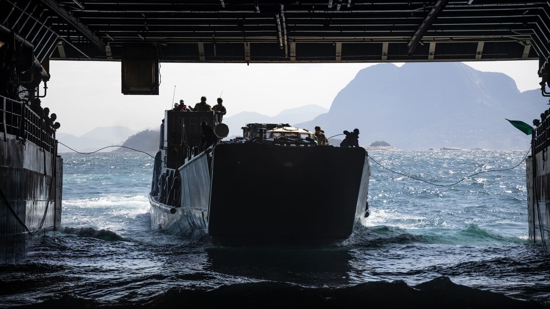 U.S. Navy Landing Craft, Utility 1663 enters the well deck of the amphibious transport dock ship USS Mesa Verde (LPD 19) during embarkation operations off the coast of Brazil, Sept. 6, 2022.  Marines and their equipment embarked the Mesa Verde in preparation for amphibious training events during exercise UNITAS LXIII. UNITAS is the world’s longest-running annual multinational maritime exercise that focuses on enhancing interoperability among multiple nations and joint forces during littoral and amphibious operations in order to build on existing regional partnerships and create new enduring relationships that promote peace, stability, and prosperity in the U.S. Southern Command’s area of responsibility. (U.S. Marine Corps photo by Sgt. Brendan Mullin)