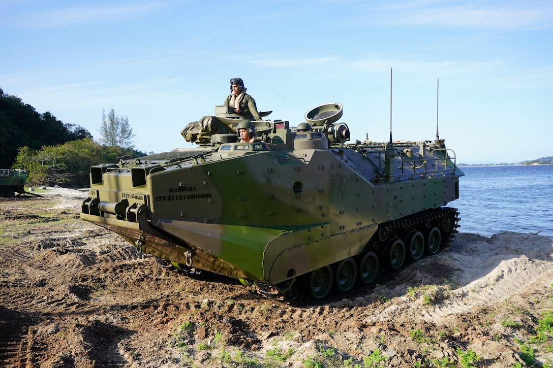 Marines from Brazil’s Amphibious Vehicle Battalion (Batalhao de Viatures) demonstrate vehicle capabilities as they simulate an amphibious raid along the shoreline of Ilha do Governador Brazilian Marine Corps base, Rio de Janeiro, during Exercise UNITAS LXIII, Sept. 7, 2022. 4th Assault Amphibian Battalion, Marine Forces Reserve,  in support of Special Purpose Marine Air-Ground Task Force UNITAS LXIII, worked alongside Brazilian Marines to work up to a culminating event. UNITAS is the world's longest-running annual multinational maritime exercise that brings together forces from 19 countries to include Brazil, Cameroon, Chile, Colombia, Dominican Republic, Ecuador, France, Guyana, Jamaica, Mexico, Namibia, Panama, Paraguay, Peru, South Korea, Spain, United Kingdom, Uruguay, and the United States. The exercise focuses on enhancing interoperability among multiple nations and joint forces during littoral and amphibious operations in order to build on existing regional partnerships and create new enduring relationships that promote peace, stability and prosperity in the U.S. Southern Command’s area of responsibility. (U.S. Marine Corps photo by Major Jeremy Wheeler)