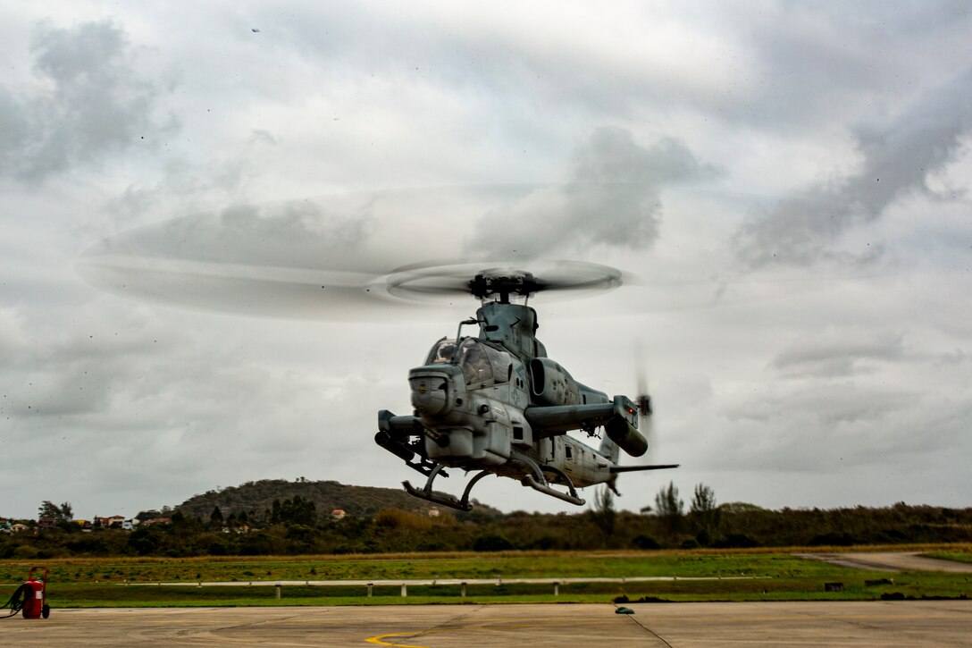 An AH-1Z Viper attack helicopter with Marine Light Attack Helicopter Squadron (HMLA) 773, 4th Marine Aircraft Wing, Marine Forces Reserve in support of Special Purpose Marine Air-Ground Task UNITAS LXIII, taxis to the runway at São Pedro da Aldeia, Brazil, Sept. 11, 2022. UNITAS is the world's longest-running annual multinational maritime exercise that focuses on enhancing interoperability among multiple nations and joint forces during littoral and amphibious operations in order to build on existing regional partnerships and create new enduring relationships that promote peace, stability, and prosperity in the U.S. Southern Command’s area of responsibility. (U.S. Marine Corps photo by 1st Lt. Mark L. Andries)