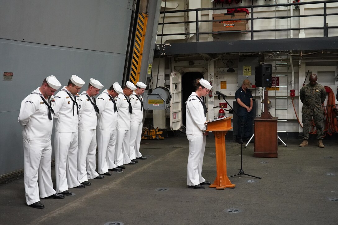 1st class petty officers of the USS Mesa Verde (LPD 19), lead a moment of silence during a memorial ceremony in remembrance of the events of Sept. 11, 2001, and the subsequent decades of war that followed while underway during exercise UNITAS LXIII, off the coast of Brazil, Sept. 11, 2022. The ceremony recognized those who were lost on 9/11 and afforded the service members time to reflect on their service and patriotism. UNITAS, which is Latin for ‘unity,’ trains forces from across the globe in South America to conduct joint maritime operations through the execution of anti-surface, anti-submarine, anti-air, amphibious, and electronic warfare operations that enhance warfighting proficiency and increase interoperability among participating naval and marine forces. The exercise builds, sustains, and sharpens partnerships in the region while exchanging military proficiencies across the 19 participating nations. (U.S. Marine Corps photo by Maj. Jeremy Wheeler)