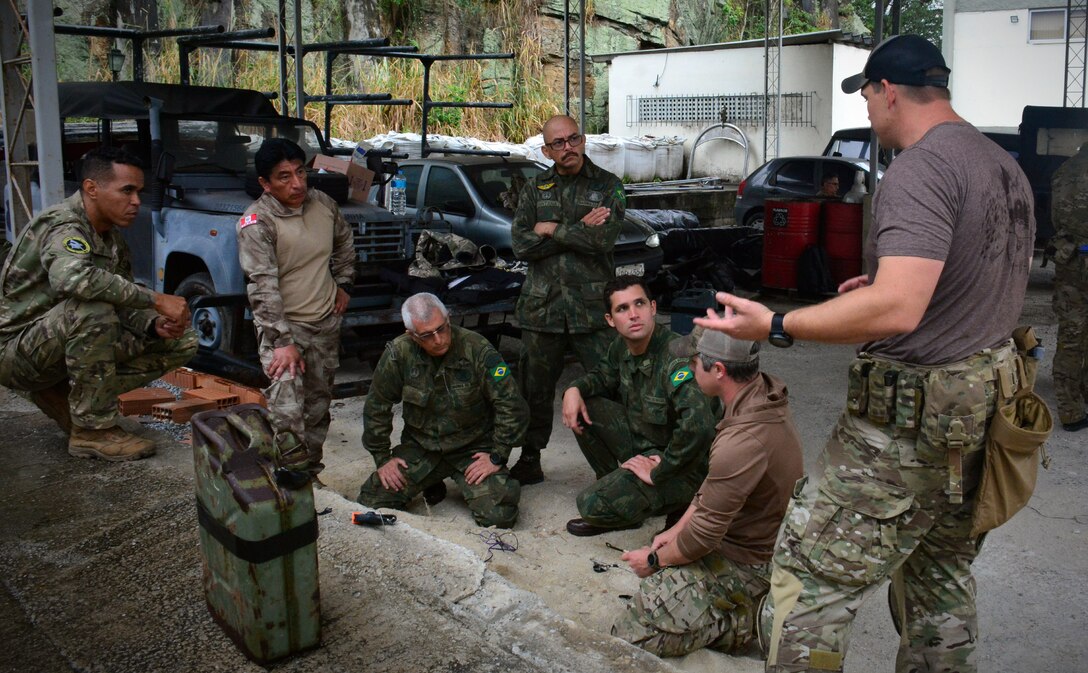 RIO DE JANEIRO (Sept. 15, 2022) Members of Explosive Ordnance Disposal Mobile Unit (EODMU) brief their Brazilian counterparts during UNITAS LXIII, Sept. 15, 2022. UNITAS is the world’s longest-running maritime exercise. Hosted this year by Brazil, it brings together multinational forces from Belize, Brazil, Cameroon, Chile, Colombia, Dominican Republic, Ecuador, France, Guyana, Jamaica, Mexico, Namibia, Panama, Paraguay, Peru, South Korea, Spain, United Kingdom, Uruguay, and the United States conducting operations in and off the coast of Rio de Janeiro. The exercise trains forces to conduct joint maritime operations through the execution of anti-surface, anti-submarine, anti-air, amphibious and electronic warfare operations that enhance warfighting proficiency and increase interoperability among participating naval and marine forces. (U.S. Navy photo by Mass Communication Specialist 3rd Class Jahlena Royer/Released)
