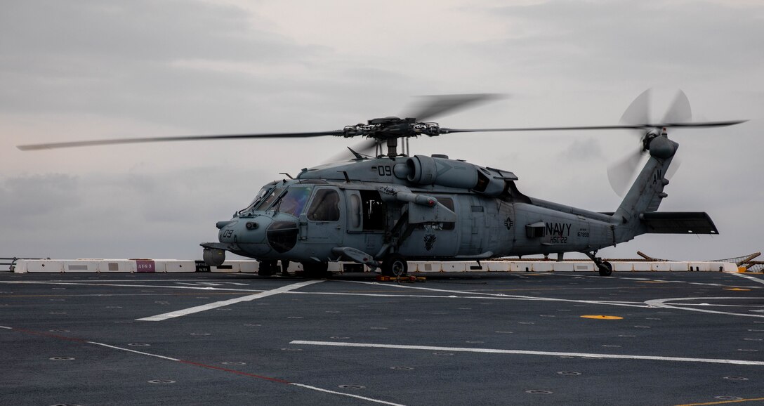 ATLANTIC OCEAN (Sept. 14, 2022) – A MH-60 Sea Hawk helicopter pilot starts the engines in preparation for take-off during flight operations onboard the amphibious transport dock ship USS Mesa Verde (LPD 19), Sept. 14, 2022. Mesa Verde is currently underway in the Atlantic Ocean in support of exercise UNITAS LXIII. UNITAS is the world’s longest-running maritime exercise. Hosted this year by Brazil, it brings together multinational forces from Belize, Brazil, Cameroon, Chile, Colombia, Dominican Republic, Ecuador, France, Guyana, Jamaica, Mexico, Namibia, Panama, Paraguay, Peru, South Korea, Spain, United Kingdom, Uruguay, and the United States conducting operations in and off the coast of Rio de Janeiro. The exercise trains forces to conduct joint maritime operations through the execution of anti-surface, anti-submarine, anti-air, amphibious and electronic warfare operations that enhance warfighting proficiency and increase interoperability among participating naval and marine forces. (U.S. Navy photo by Mass Communication Specialist 3rd Class Sydney Milligan)