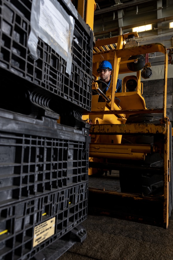 U.S. Navy Boatswains Mate 2nd Class Roman Shrader, assigned to the amphibious transport dock ship USS Mesa Verde (LPD 19), prepares to move U.S. Marine Corps equipment through the well deck of the Mesa Verde in Rio de Janeiro in support of Special Purpose Marine Air-Ground Task Force UNITAS LXIII, Sept. 3, 2022. Marines and their equipment are moving ashore from the Mesa Verde to begin training during UNITAS LXIII.  UNITAS is the world’s longest-running annual multinational maritime exercise that focuses on enhancing interoperability among multiple nations and joint forces during littoral and amphibious operations in order to build on existing regional partnerships and create new enduring relationships that promote peace, stability and prosperity in the U.S. Southern Command’s area of responsibility. (U.S. Marine Corps photo by Sgt. Brendan Mullin)