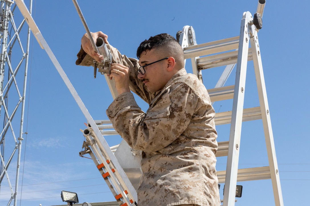 installs a 5G antenna in preparation for a 5G network demonstration at MCAGCC