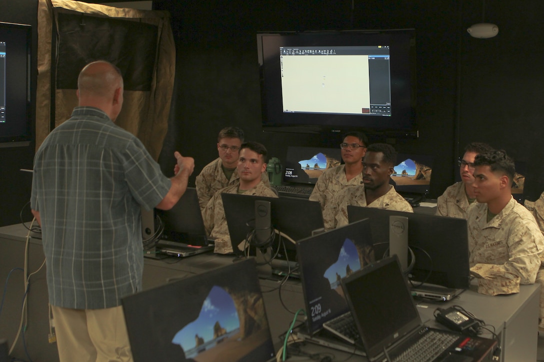 Marines participate in a familiarization brief with 5G-enabled devices at MCAGCC