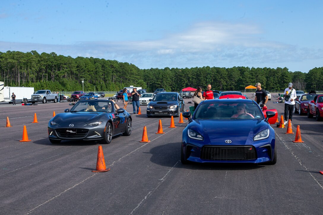 Participants stage their cars on the Autocross course at Marine Corps Air Station Cherry Point, North Carolina, Sep. 17, 2022. The event was facilitated by the Sports Car Club of America and the Single Marine Program. Participants were separated by vehicle class, such as novice, street, race, American muscle, and raced for the fastest time. (U.S. Marine Corps photo by Sgt. Christian J. Lopez