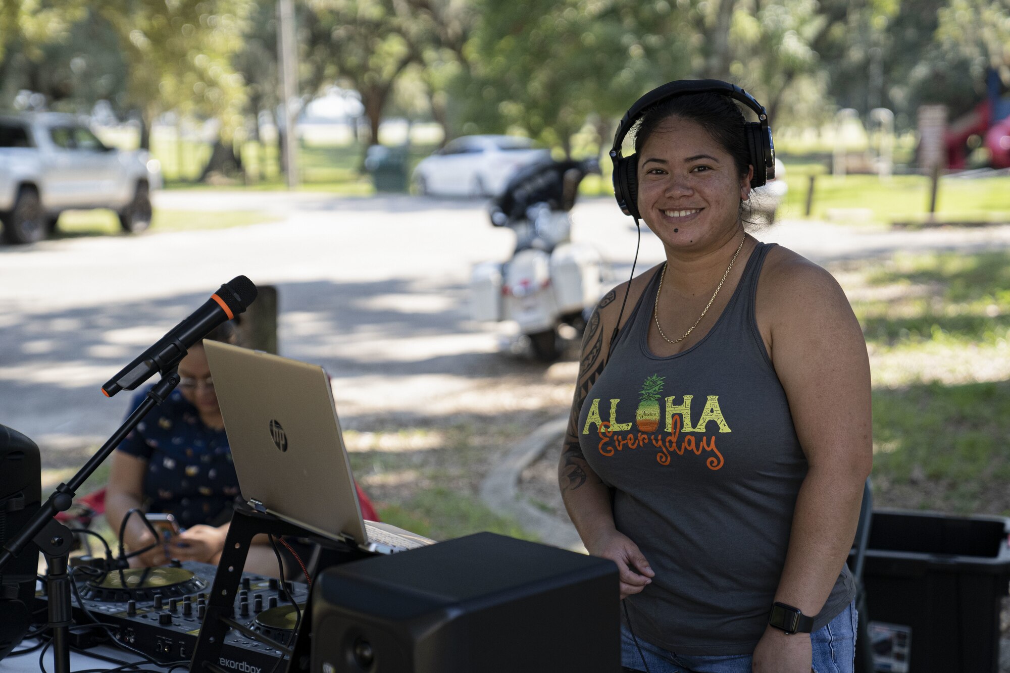 U.S. Air Force Senior Airman Rozlynne Fernandez, 81st Security Forces Squadron executive assistant, plays music during the squadron’s morale day at the marina on Keesler Air Force Base, Mississippi, Sept. 16, 2022. The squadron used Unite Funds to celebrate their first morale day since the start of COVID-19.