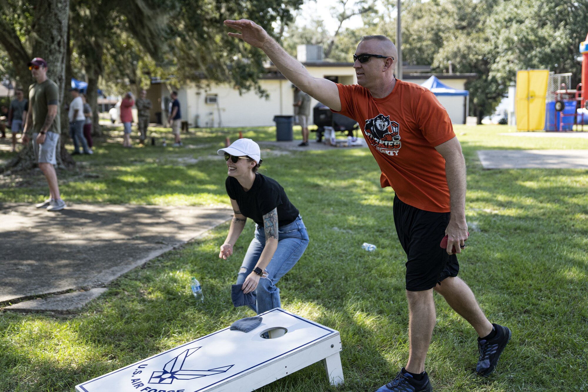 U.S. Air Force Master Sgt. Matthew Oleson, 81st Security Forces Squadron plans and programs section chief, and Tech. Sgt. Kayla Rykowski, 81st SFS chief of investigation, play cornhole during the squadron’s morale day at the marina on Keesler Air Force Base, Mississippi, Sept. 16, 2022. The squadron used Unite Funds to celebrate their first morale day since the start of COVID-19.