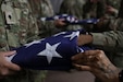 U.S. Army Reserve Spc. Dean Do (left) and Cpt. Jessica Modique (right) from the 367th MPAD practice folding the American flag, 11 September, 2022, Whitehall OH. Soldiers from the 367th MPAD participated in a military funeral honors recruitment brief, hosted by a representative from the 412th Civil Affairs Battalion. (U.S. Army Reserve photo by Sgt. Zachary Johnson)