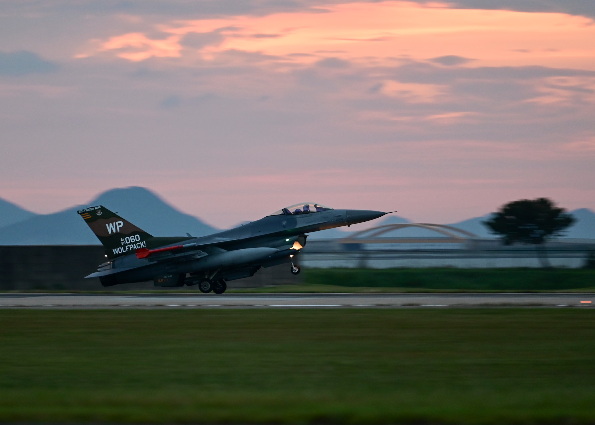 An F-16 Fighting Falcon, the 8th Fighter Wing’s flagship aircraft, lands on the runway at Kunsan Air Base, Republic of Korea, Sept. 14, 2022. Flagship aircraft are typically assigned to the wing commander and showcase a custom paint job relative to the wing. (U.S. Air Force photo by Staff Sgt. Isaiah J. Soliz)
