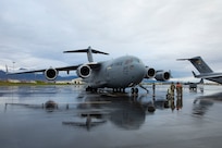 Service members of Alaska Air National Guard's 176th Wing conduct an engine check on a C-17 Globemaster II prior to take off for Eielson Air Force Base, Sept. 21, 2022. Approximately 100 members of the Alaska Organized Militia, which is comprised of the Alaska National Guard, Alaska State Defense Force and Alaska Naval Militia, were activated following a disaster declaration issued Sept. 17 after the remnants of Typhoon Merbok caused dramatic flooding across more than 1,000 miles of Alaskan coastline. (Alaska National Guard photo by Victoria Granado)