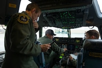 Flight crew of Alaska Air National Guard's 144th Airlift Squadron conduct pre-flight checks on a C-17 Globemaster II prior to take off for Eielson Air Force Base, Sept. 21, 2022. Approximately 100 members of the Alaska Organized Militia, which is comprised of the Alaska National Guard, Alaska State Defense Force and Alaska Naval Militia, were activated following a disaster declaration issued Sept. 17 after the remnants of Typhoon Merbok caused dramatic flooding across more than 1,000 miles of Alaskan coastline. (Alaska National Guard photo by Victoria Granado)