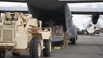 Members of Joint Task Force – Alaska off load equipment and supplies after arriving in Bethel for disaster relief response Sept. 21, 2022, via a HC-130J Combat King II aircraft from the 176th Wing’s 211th Rescue Squadron. Approximately 100 service members from the Alaska National Guard, Alaska State Defense Force and Alaska Naval Militia were activated following a disaster declaration issued Sept. 17 after the remnants of Typhoon Merbok caused dramatic flooding across more than 1,000 miles of Alaskan coastline. A JTF in Nome is standing up concurrently as part of Operation Merbok Response (Alaska National Guard photo by Dana Rosso)