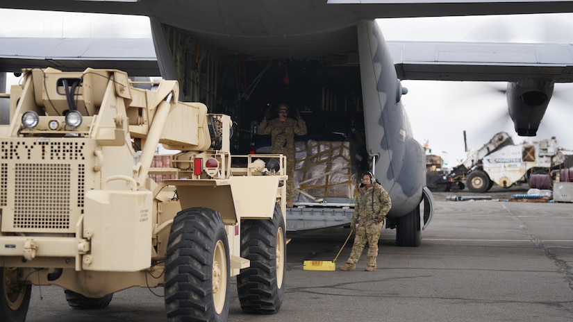 Members of Joint Task Force – Alaska off load equipment and supplies after arriving in Bethel for disaster relief response Sept. 21, 2022, via a HC-130J Combat King II aircraft from the 176th Wing’s 211th Rescue Squadron. Approximately 100 service members from the Alaska National Guard, Alaska State Defense Force and Alaska Naval Militia were activated following a disaster declaration issued Sept. 17 after the remnants of Typhoon Merbok caused dramatic flooding across more than 1,000 miles of Alaskan coastline. A JTF in Nome is standing up concurrently as part of Operation Merbok Response (Alaska National Guard photo by Dana Rosso)