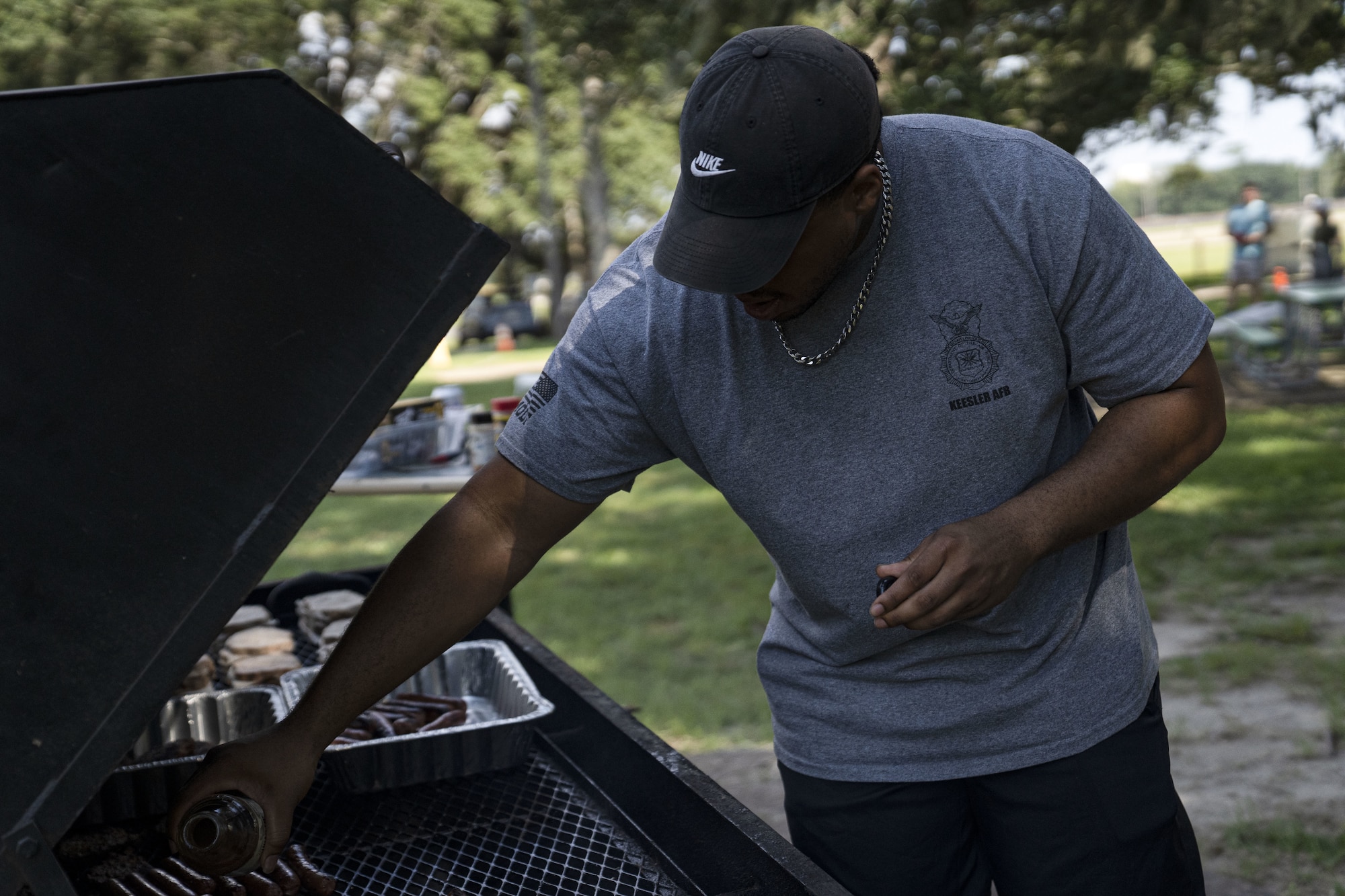 U.S. Air Force Tech. Sgt. Perry Sinclair, 81st Security Forces Squadron days flight chief, grills food for the squadron’s morale day at the marina on Keesler Air Force Base, Mississippi, Sept. 16, 2022. The squadron used Unite Funds to celebrate their first morale day since the start of COVID-19.