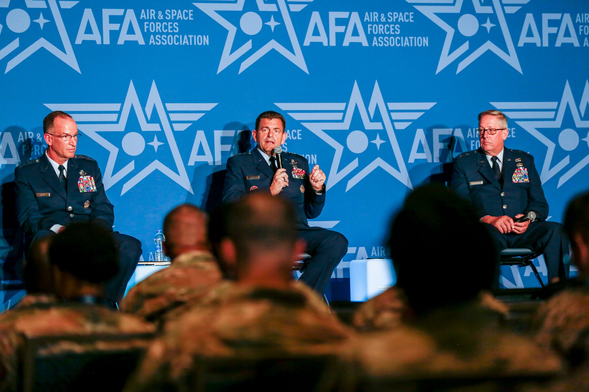 Air Force Lt. Gen. Michael A. Loh, director, Air National Guard, center; Lt. Gen. John P. Healy, chief, Air Force Reserve, left and Maj. Gen. Daryl L. Bohac, Nebraska adjutant general, discuss the Air Force reserve component during a panel at the 2022 Air and Space Forces Association's Air, Space and Cyber Conference in National Harbor, Maryland, Sept. 19, 2022. (U.S. Army National Guard photo by Sgt. 1st Class Zach Sheely)