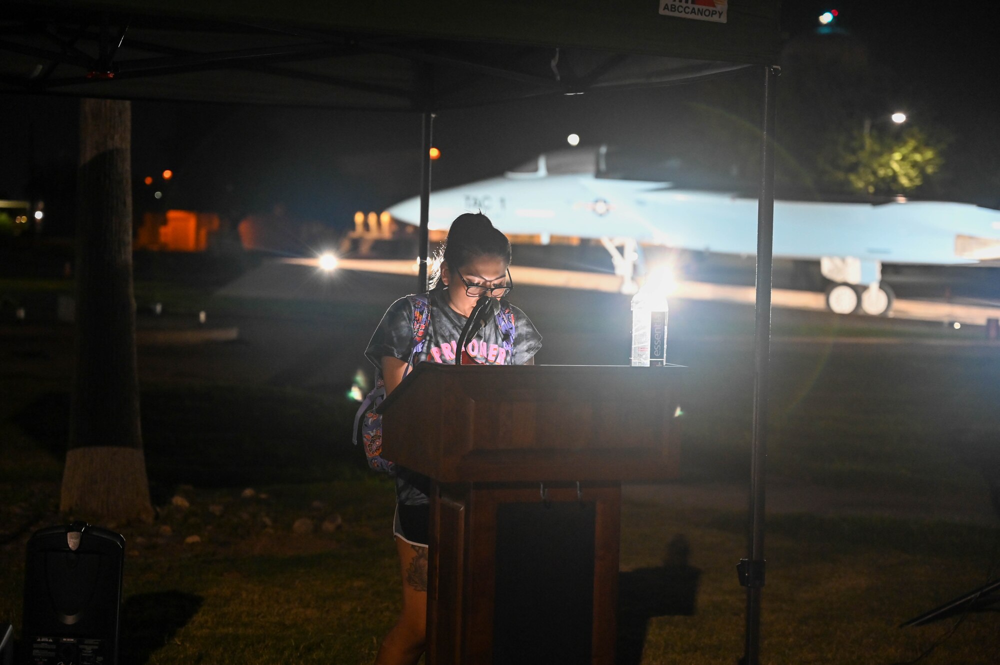 A U.S. Air Force Airman from the 56th Fighter Wing reads out the names of missing service members during a POW/MIA vigil, Sept. 15, 2022, at Luke Air Force Base, Arizona.